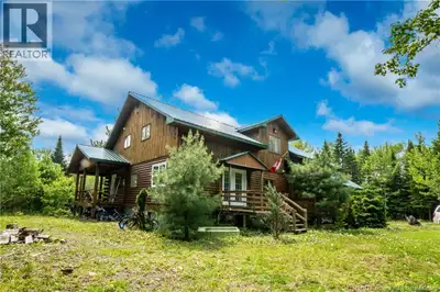Peace, quiet, and privacy on your waterfront family-sized log home in the woods! Welcome to 58 Buba...