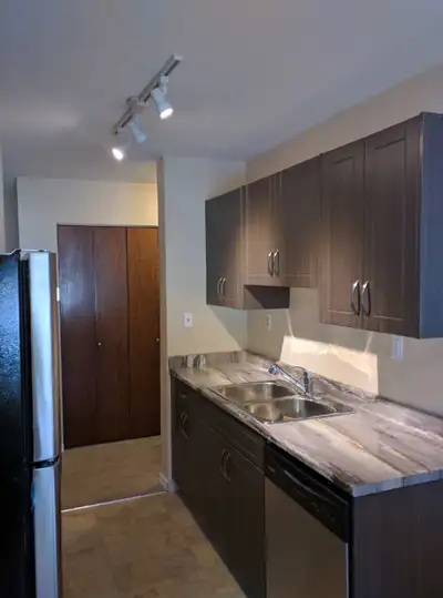 Large 2 bedroom TOP Floor Corner Suite!! Central to everything!! SW facing unit! Avail December 1st!...