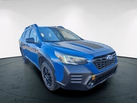 The 2022 Subaru Outback Wilderness in a striking blue finish with an all-wheel-drive system is your... (image 8)