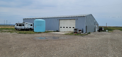 Heated shop for rent with yard parking/storage
