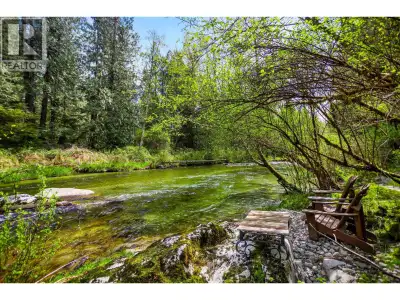 Privacy, seclusion, and a truly one-of-a-kind! This exceptional riverfront RECREATION home & tranqui...