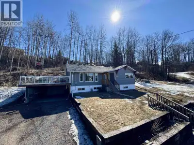 Situated on nearly an acre on a quiet street, this 4-bedroom, 2-bathroom property is located beside...