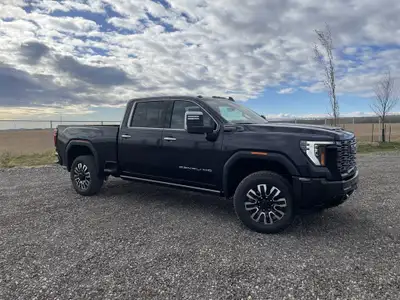 AMVIC Licensed Dealer The 2026 GMC Sierra 2500HD Denali Ultimate, finished in Titanium Rush Metallic...