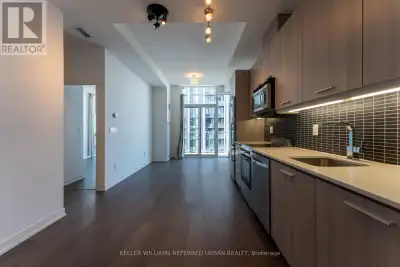 Penthouse-level one bedroom suite at Post House Condos featuring ultra tall 10-foot ceilings, a feat...