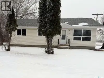 Opportunity awaits with this 1,040 sq ft bungalow located on a large corner lot just behind the Oxbo...