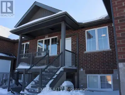 Unit #203 - 15 Arthur Street offers a bright and modern 2-bedroom condo townhome with a private entr...