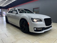The 2023 Chrysler 300, particularly the 300C RWD in pristine white, is a powerful sedan that truly s... (image 6)