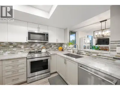 RENOVATED CORNER UNIT, one of only a few layouts with 2 balconies & open private views. In the heart...