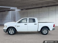 This commanding 2023 Ram 1500 Classic SLT Crew Cab Pickup, shimmering in Bright White with a functio... (image 3)