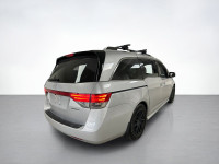 Our used family-friendly 2014 Honda Odyssey Touring is shown in stunning Alabaster Silver Metallic.... (image 4)