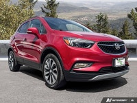 The 2020 Buick Encore Essence, dazzling in Winterberry Red Metallic with a sophisticated Ebony leath... (image 6)