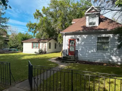 Attention Developers & Visionaries! This 1920 built home sits on a large 75x120, mature lot in one o...