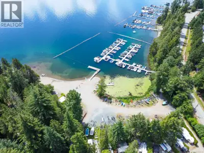 Waterfront Tall Timbers Holiday Park on Sproat Lake! Enjoy affordable lakeside living in this gated,...