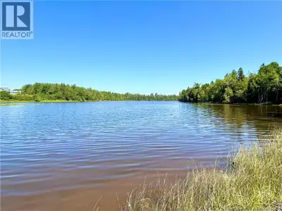 Welcome to the lovely community of Black River Bridge, New Brunswick! This 3,036 square meter waterf...