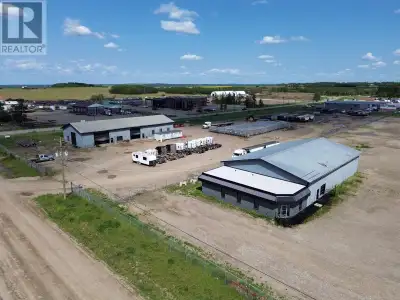 Great visibility for your business! 2 shops located off airport road with 15.29 acres Light Industri...