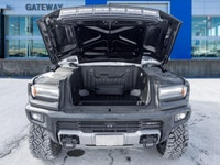 The 2024 GMC HUMMER EV SUV 2X commands attention with an electrified, wide-body stance that blends b... (image 9)