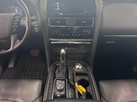 Experience luxury and power in the 2024 Nissan Armada 4x4 Platinum, presented in an eye-catching Bla... (image 7)