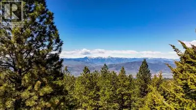 SPECTACULAR VIEWS await from this exceptional acreage just minutes from downtown Osoyoos. Offering p...
