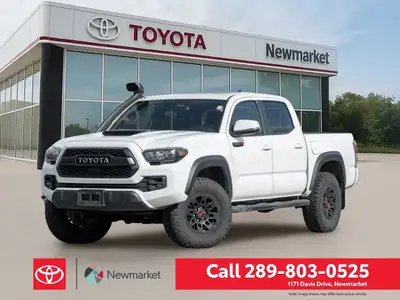 The 2019 Toyota Tacoma TRD Off Road 4x4 Double Cab V6 in a stunning white color with a robust 4x4 dr...