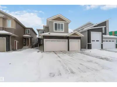 Beautiful 3-bedroom home with a triple attached heated garage and a fully finished 2-bedroom legal b...