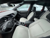 The 2019 Volkswagen Jetta Highline, presented in eye-catching Habanero Orange Metallic with a sophis... (image 3)