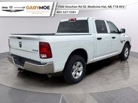 Presenting the stunning 2023 Ram 1500 Classic SLT 4x4 Crew Cab in an elegant White finish, paired wi... (image 2)
