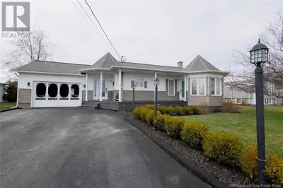This delightful home offers a fantastic open-concept design, seamlessly blending the kitchen, dining...