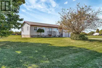 Perfectly placed between Lake Ontario & East Lake, and set on an expansive 6-acre property, this tid...