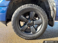 The 2015 *Ram 1500 ST* in *Blue Streak Pearl* is a rugged, dependable truck designed for work and pl... (image 9)