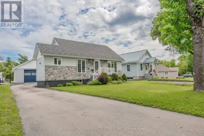 If you're searching for a cozy, well-maintained bungalow with your dream garage, look no further! Th...
