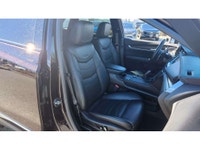 Some luxury SUVs focus only on comfort. The Cadillac XT5 Sport adds real driving confidence to the e... (image 8)