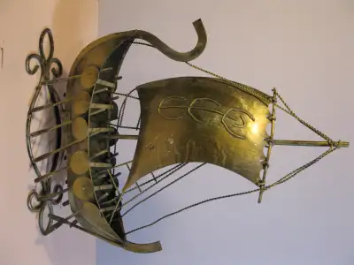Nice display items for the boat enthusiast. Viking ship is 13" long at base and 17" high Copper sail...