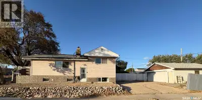 Welcome to this charming and fully developed 4 level split, perfectly located across from parks, sch...