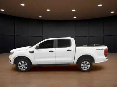 Experience the power of a 2019 Ford Ranger XLT in a crisp white finish, equipped with a robust 4x4 d...