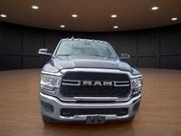 Meet the 2022 Ram 3500 Tradesman in an attractive brown hue with a robust 4x4 drivetrain, built to h... (image 1)