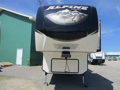 A four slide fifth wheel with lots of storage ! There is a front queen bedroom w/ wardrobe & dresser...