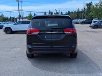 The 2026 Chrysler Grand Caravan SXT in Diamond Black Crystal Pearl with a Black interior offers a bl... (image 4)