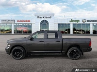 Feel the surge of a legendary *5.7L Hemi V8 engine* under your command with this striking *2023 Ram... (image 1)
