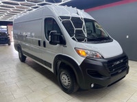 The 2025 Ram ProMaster Cargo Van in a clean white finish, equipped with front-wheel drive, is design... (image 2)