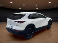The 2022 Mazda CX-30 GT w/Turbo AWD in stunning white exudes confidence and offers a smooth handling... (image 5)