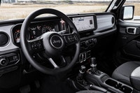 This Jeep Wrangler has a dependable Intercooled Turbo Premium Unleaded I-4 2.0 L/122 engine powering... (image 7)