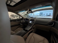 The 2016 MKX Reserve is characterized by its "Split-wing" front grille and a full-width LED taillamp... (image 8)
