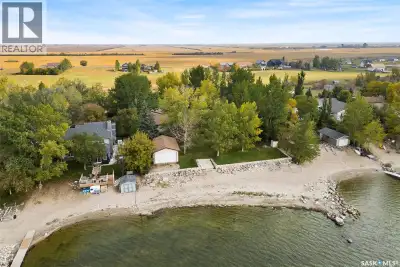 Check out this Fabulous waterfront property (144' of sandy beach) with oversize double car garage an...