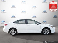 Recent Arrival! Odometer is 14620 kilometers below market average! White 2024 Toyota Corolla LE SUNR... (image 5)