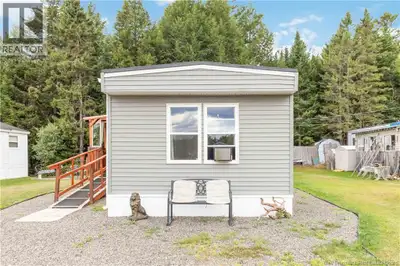 Affordable 2-Bedroom Mini-Home Backing Onto Nature Priced to Sell! Welcome to this charming and affo...