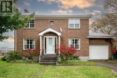 Timeless Brick Character in the Heart of Convenience! Welcome to this charming, never-before-listed...