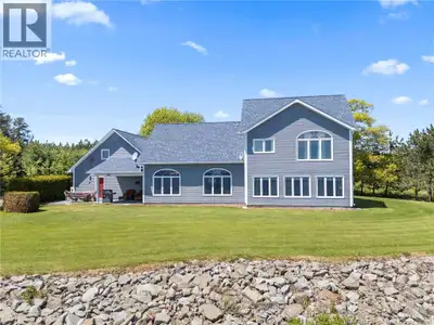Welcome to 124 Winterport Way, where waterfront living meets privacy and beauty on the shores of Gra...