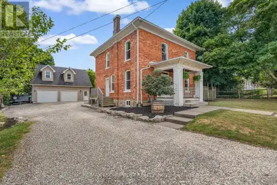 Step into the timeless charm of this classic American Foursquare home, thoughtfully blending early 1...