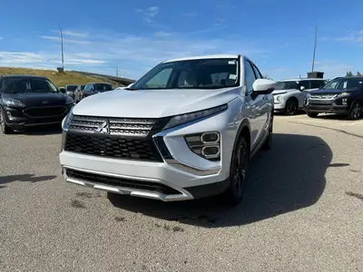 Introducing the 2026 Mitsubishi Eclipse Cross SE S-AWC, a stunning SUV dressed in a sleek coat of el...