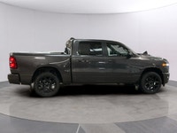 Meet the 2026 Ram 1500 Sport, a robust 4x4 Crew Cab finished in a refined gray exterior. This truck... (image 5)